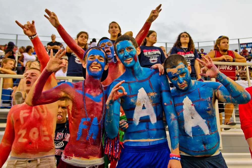 Fans were decked out in face paint and body point in support of the    football game body paint