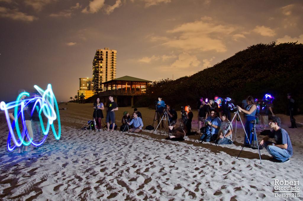 Courtesy of Robert Giordano Members of Owl Photography Club photograph a glow poi artist on Tuesday, February 11 at Palmetto Beach.