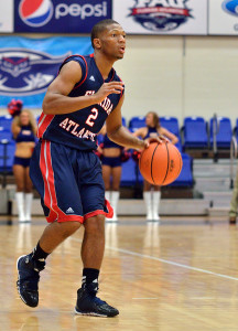 Owls guard Marquan Botley moves the ball down court during the second half. Botley scored 12 points with five assists. Photo by Ryan Murphy.