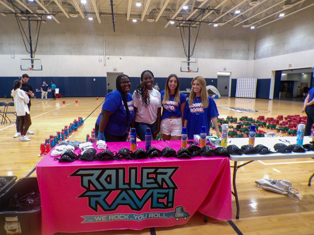  FAU students Austanni Hodge, Victoria Armand, Laura Arbo and Isabella Sanossian giving out skates to other students at the ‘Rave at the Rec’ event. 
