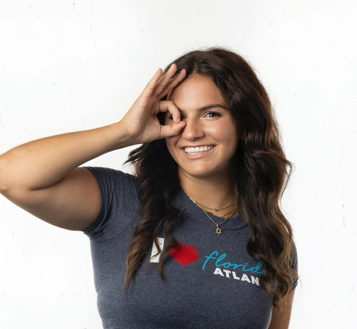 Paige Noble posing with the Owl Fingers sign. 