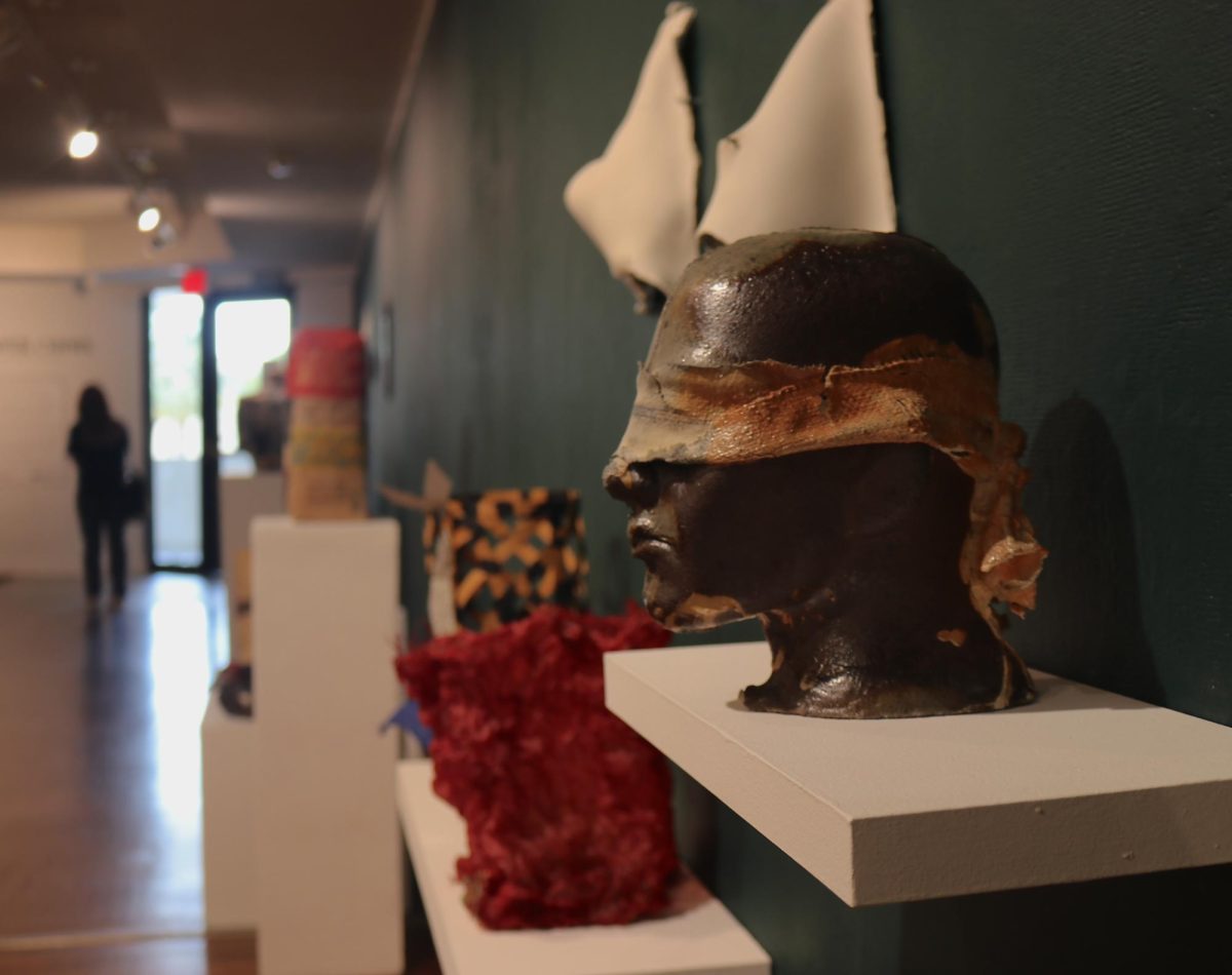 A head sculpture displayed in the front of the “Rock, Paper, Chisel" exhibit.