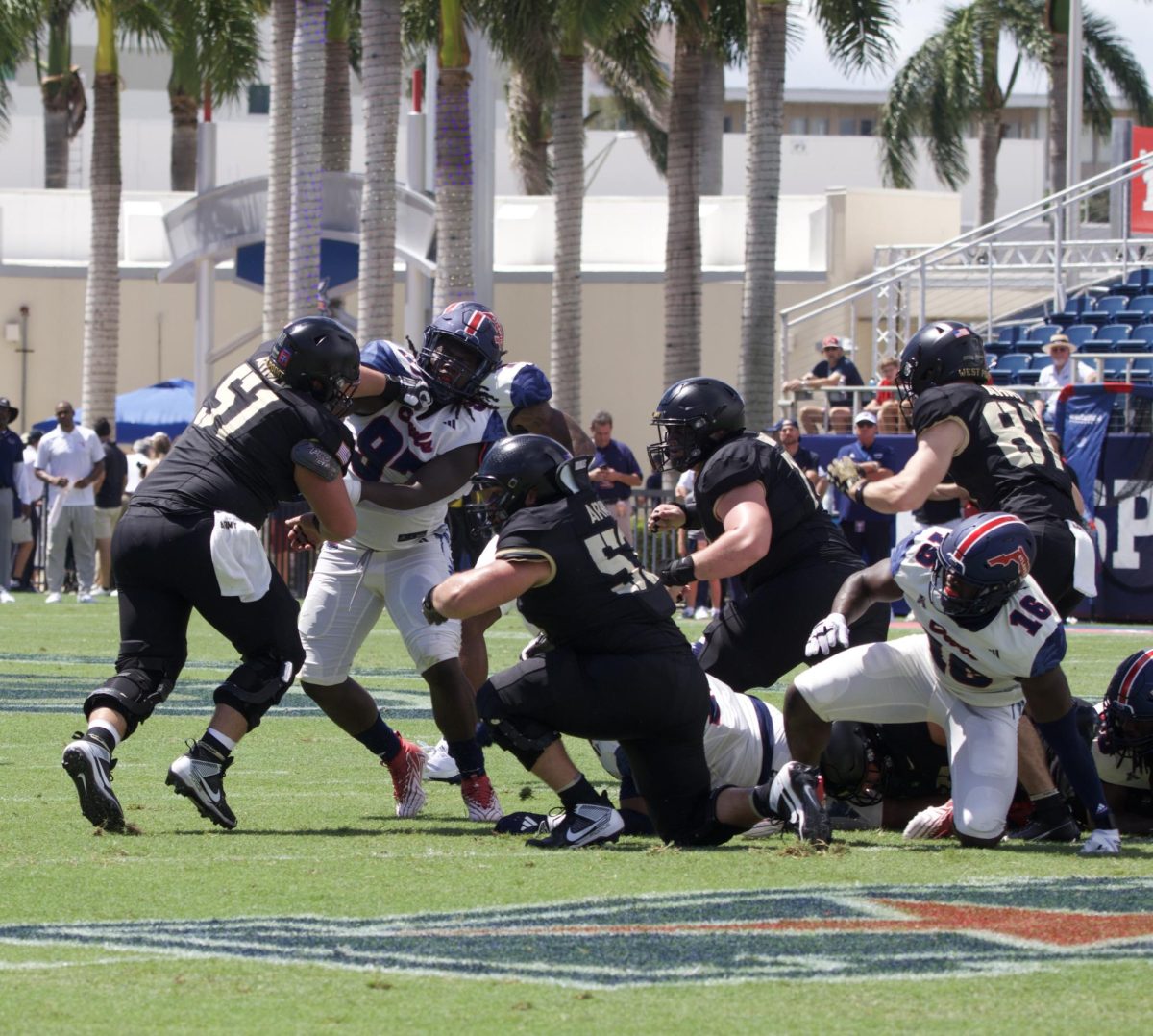 Army offensive line Brady Smalls goes head to head with FAU’s defensive lineman Devonta Davis. 