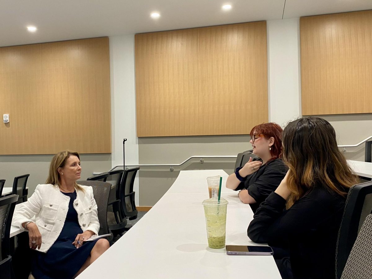 Anthropology graduate student Sydney Worrall talks to FAU Presidential Search Committee Chair Sherry Murphy during the final Boca Raton listening session on Sept. 9. 