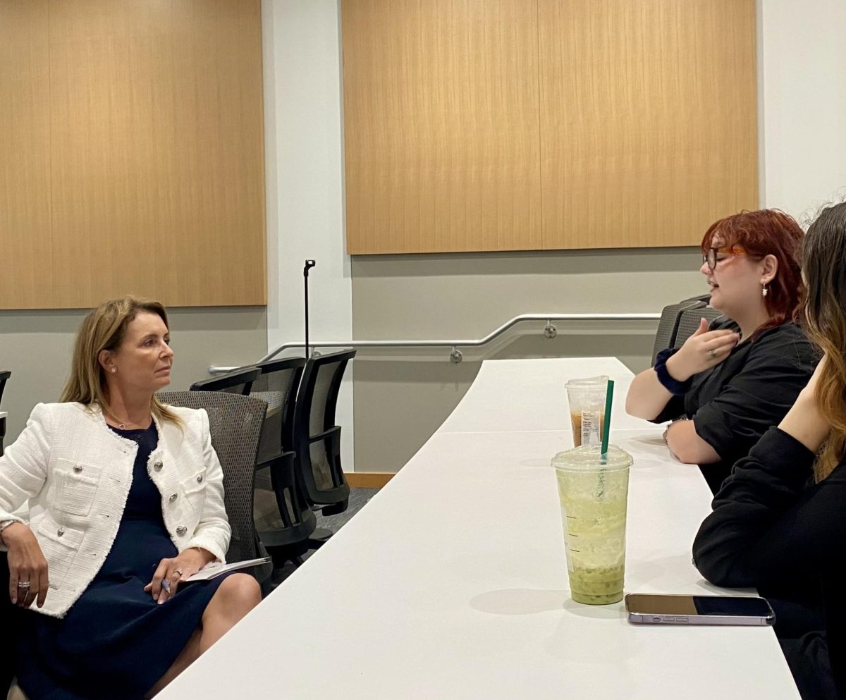 Anthropology graduate student Sydney Worrall talks to FAU Presidential Search Committee Chair Sherry Murphy during the final Boca Raton listening session on Sept. 9. 