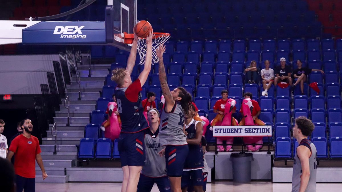 Center Matas Vokietaitis (8) going up against forward Tre Carroll (12) in an open practice for students on Sept. 17, 2024. 