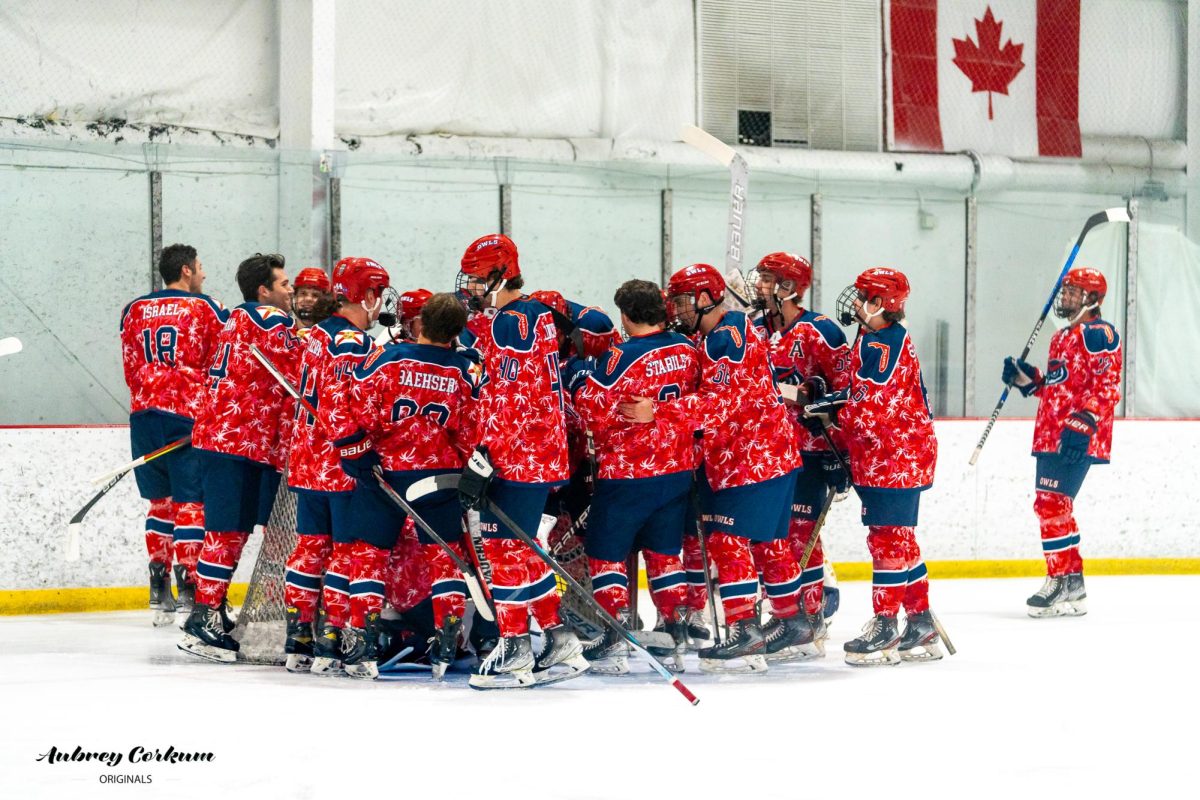 FAU huddling together during their 10-4 win over Lynn University on Oct. 25. 