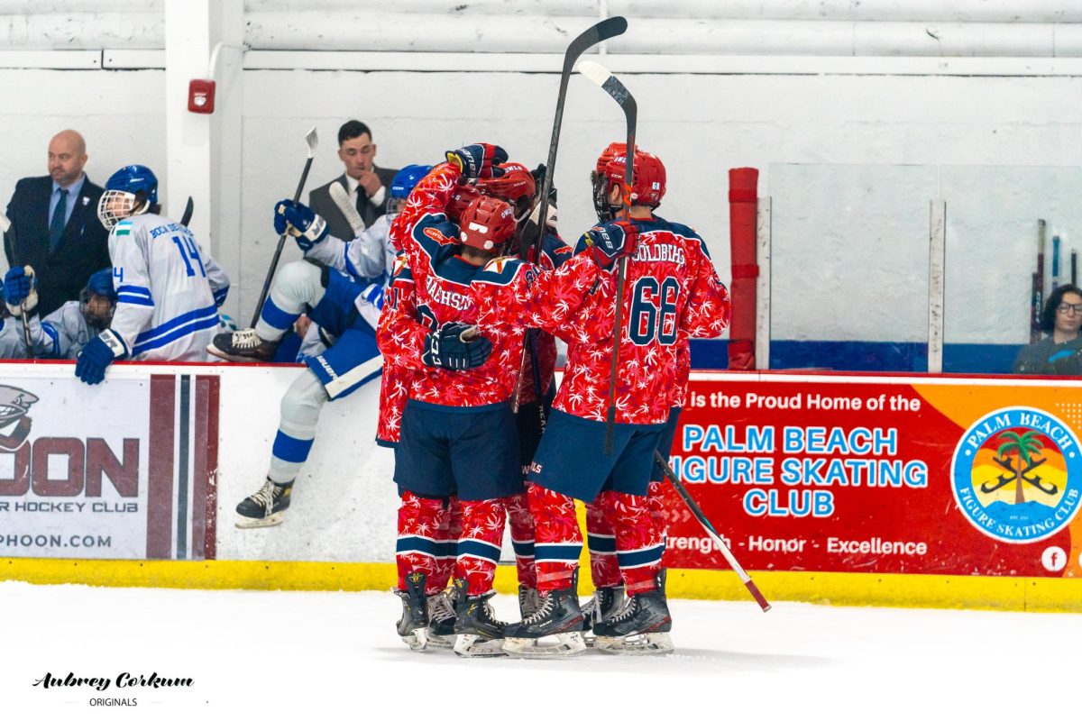 FAU huddling together during their 10-4 win over Lynn University on Oct. 25. 