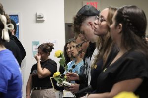 Students held yellow roses during Hillel's memorial service on Oct. 7, symbolizing remembrance and hope.