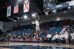 Forward Kaleb Glenn flying to the rim to dunk during FAU's exhibition game against Saint Leo University. 