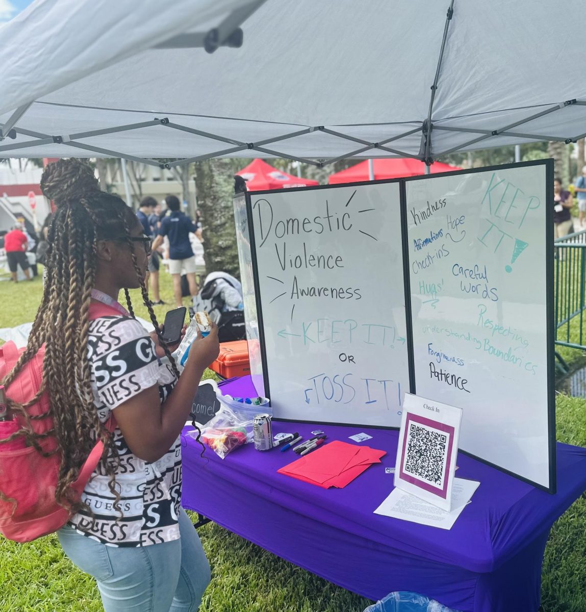 FAU student participates in the domestic violence awareness activity “Keep It."