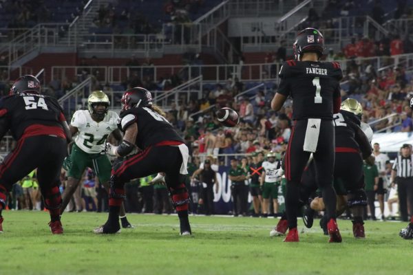 The Owls quarterback Cam Fancher receiving the snap during their homecoming game against USF on Nov. 1 where they lost 44-21. 