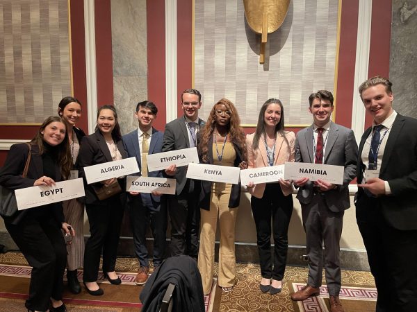 Student delegates holding the signs of the countries they represent at this year's NMUN conference in Washington, D.C. 