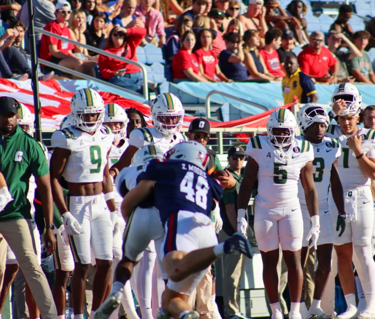 FAU tight end Zeke Moore pulling down a Charlotte player in the Owls final home game of the 2024 season. 