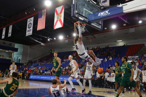 Forward Tre Carroll dunking against Saint Leo University during their exhibition game on Oct. 26. Carroll was the Owls second leading scorer of the night with 21 points.