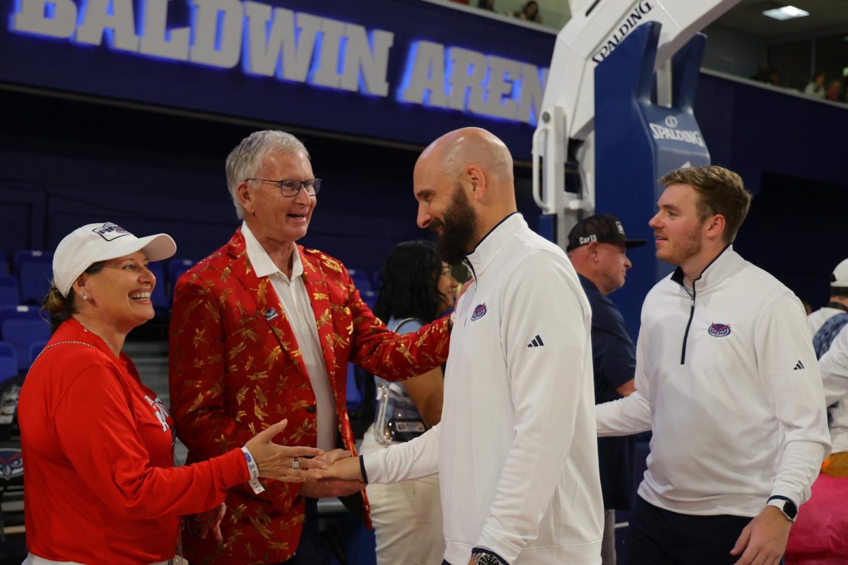 Head coach John Jakus shaking FAU fans hands after their 104-53 win against Saint Leo University in the exhibition game on Oct. 26. 