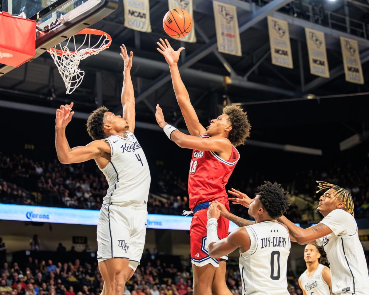 Forward Baba Miller going up to the basket against UCF's guard Keyshawn Hall. The Owls lost the game 100-94 on Nov. 12. 