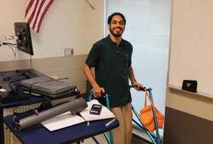 Devin Ghaness with his walker in a classroom at the FAU Culture and Society building on Aug. 28.