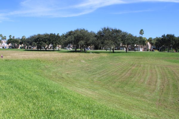 Photo of the empty field where the new residence hall is set to be constructed. (Michael Cook)