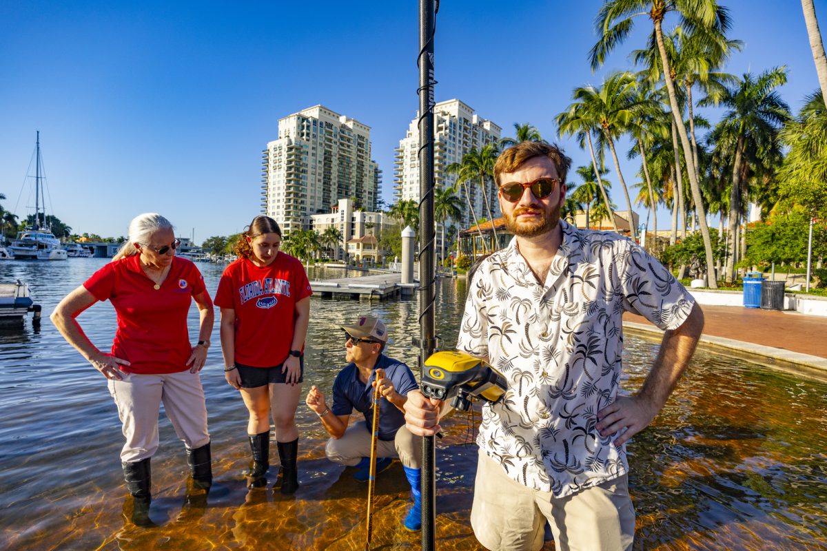  ECOS faculty and students in downtown Fort Lauderdale during a King Tide flooding event, studying tides that flood coastal landscapes across areas of Palm Beach, Broward, and Miami-Dade.