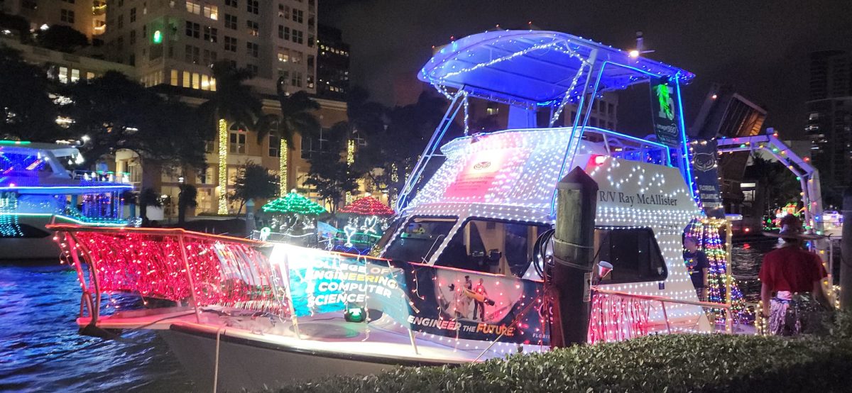 FAU’s College of Engineering and Computer Science’s Ray McCallister, used by staff and students for environmental research projects, representing FAU at the 2024 Winterfest Boat Parade.