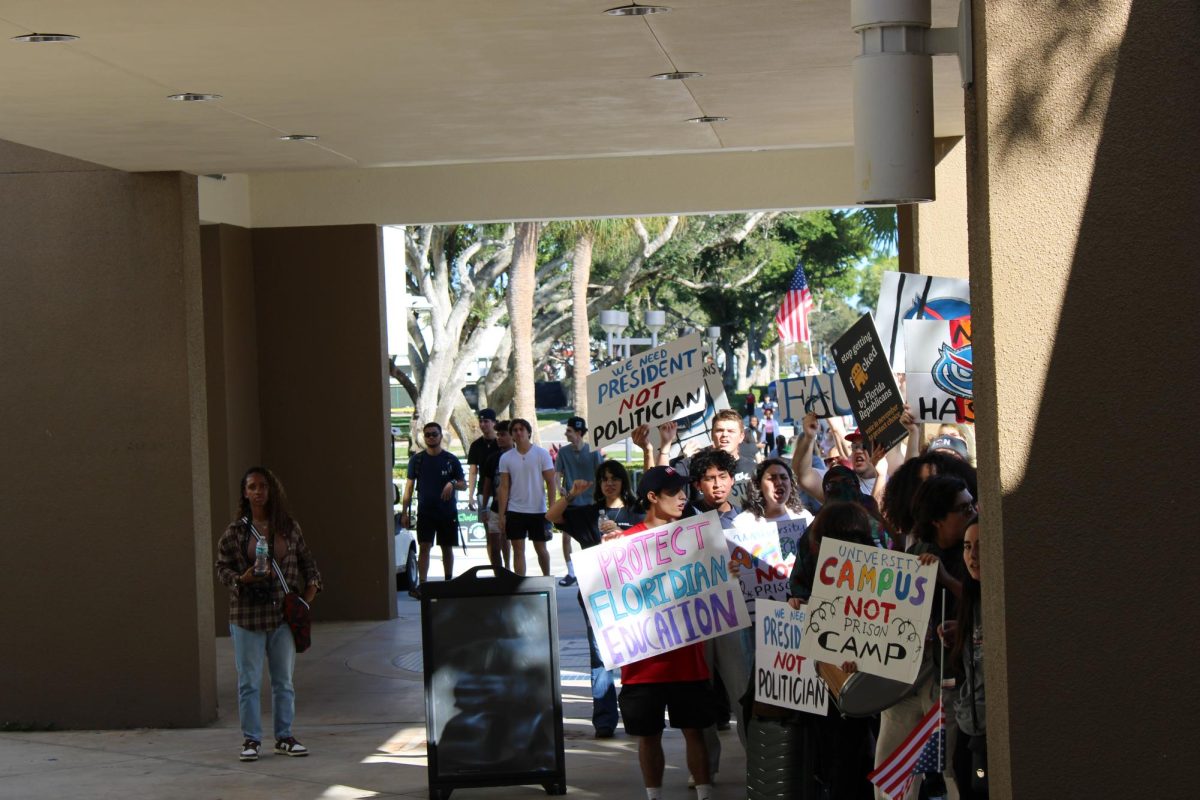 Students protesting against presidential finalist Adam Hasner on Feb 7. 