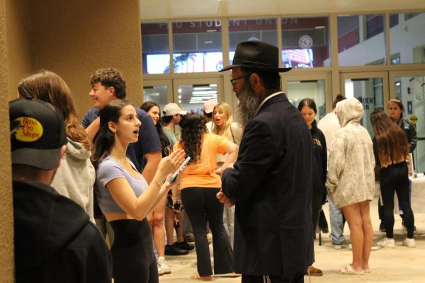 Rabbi Boruch Liberow, conversed with students before the Vigil outside the student union