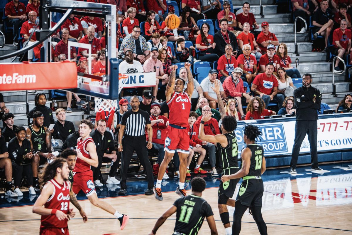 Florida Atlantic's forward Kaleb Glenn shooting a three against USF on Feb. 2. The Owls won 94-72 and Glenn finished with seven rebounds.