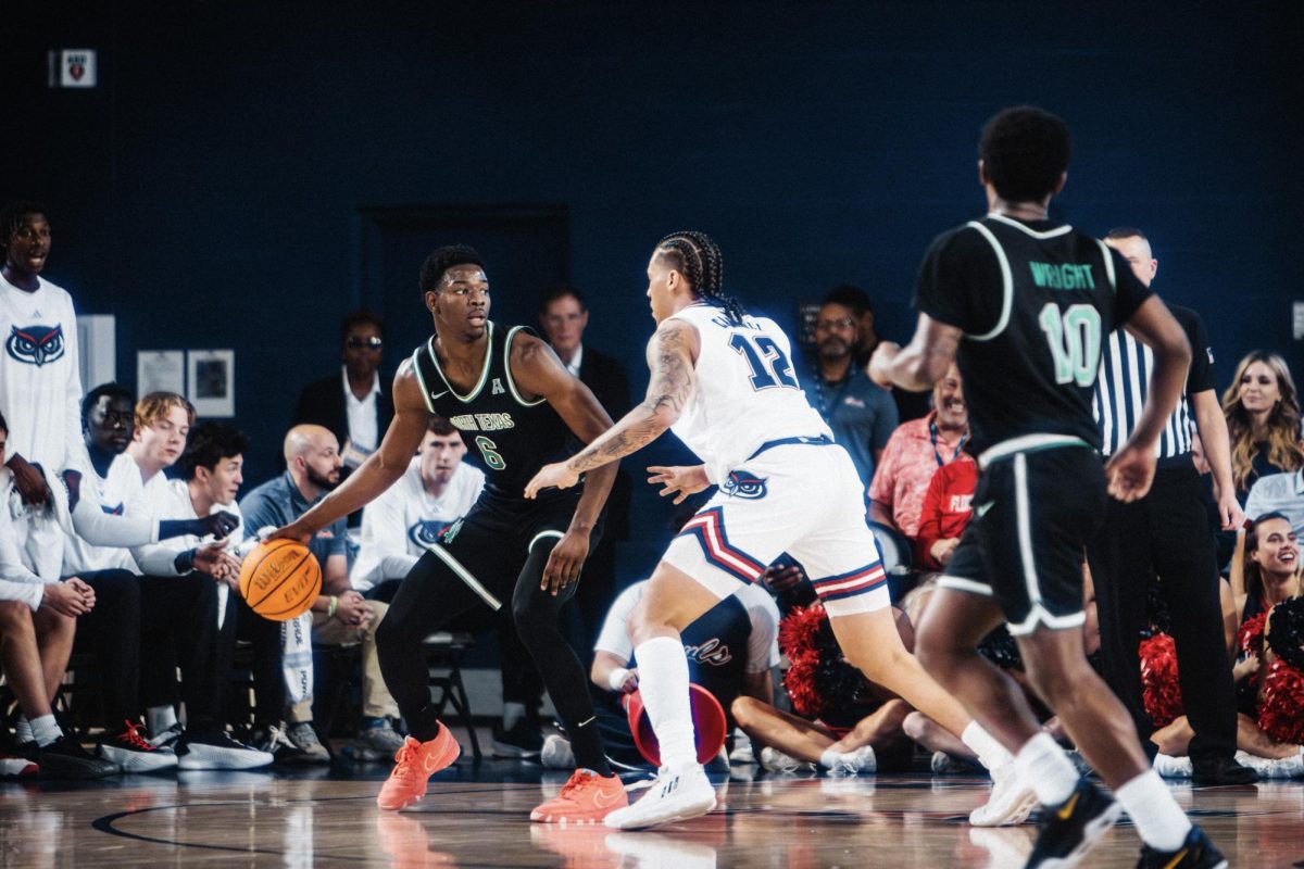 FAU's forward Tre Carroll guarding former FAU player and current North Texas forward, Brenen Lorient, during their game on Feb. 27. The Owls fell 71-61 to the Mean Green.