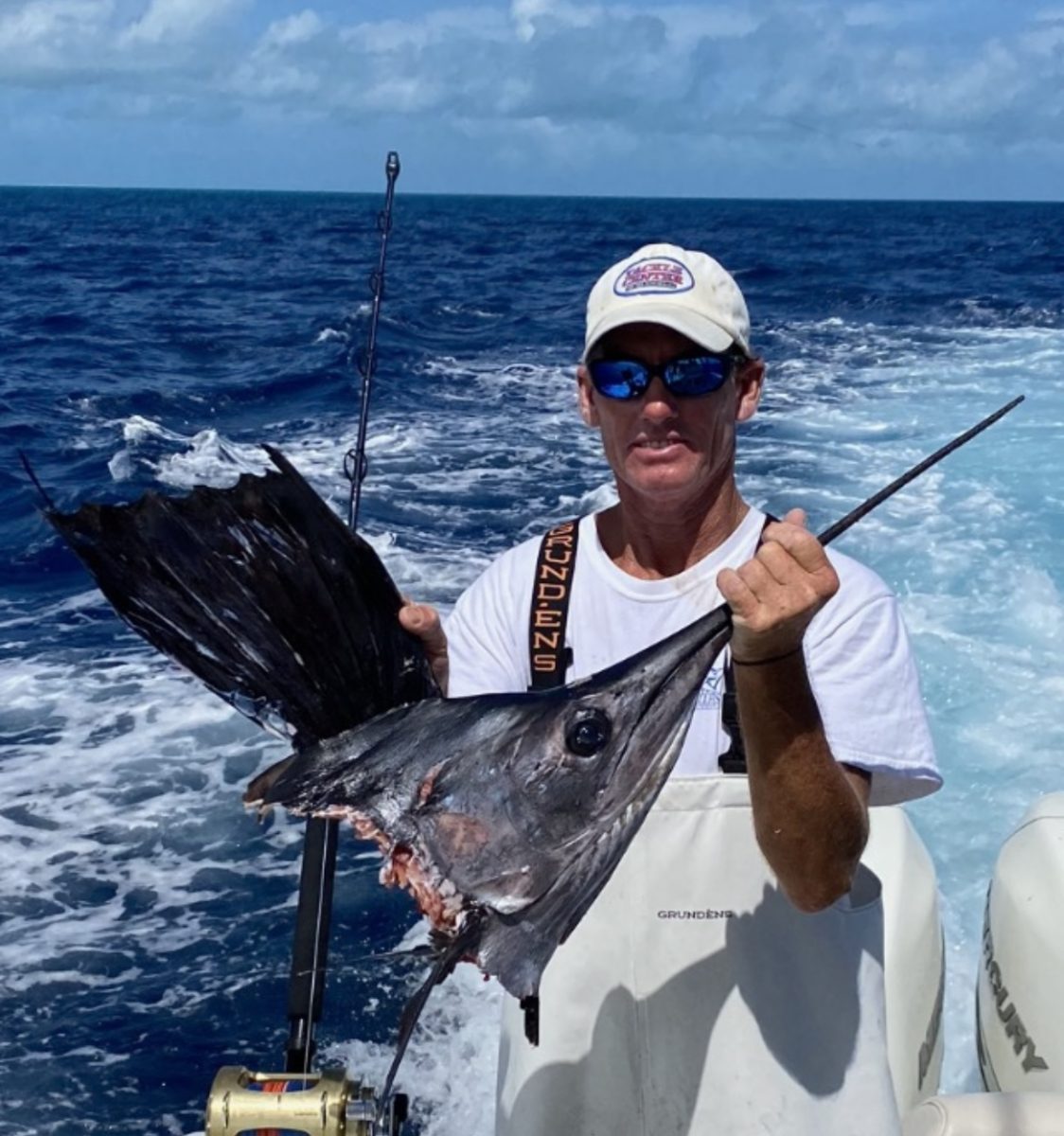 Shawn Albury, a Palm Beach County angler, holding up a depredated sailfish carcass. 