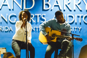 Rebecca Guillaume (left) and Christopher Felix (right) serenade the crowd with their version of "Killing Me Softly With His Song" by Roberta Flack 