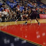 Owls leading scorer Greg Gantt sizing up his opponent. Gantt had a game-high 26 points against the Trojans. Photo by Melissa Landolfa.