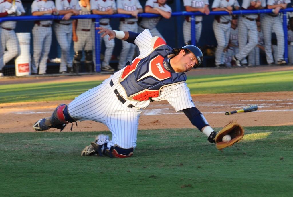 Catcher Mike Spano catches a foul ball during Friday night's loss to Troy 8-3. FAU was tied for second place in the Sun Belt standings with Troy before going into the game. Photo by Michelle Friswell