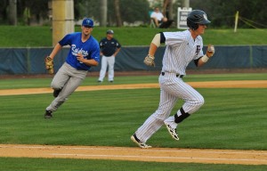 Left fielder Brendon Sanger tries to out-run a play at first base. The Owls lost to Middle Tennessee 3-2 to start the weekend series. Photo by Michelle Friswell.