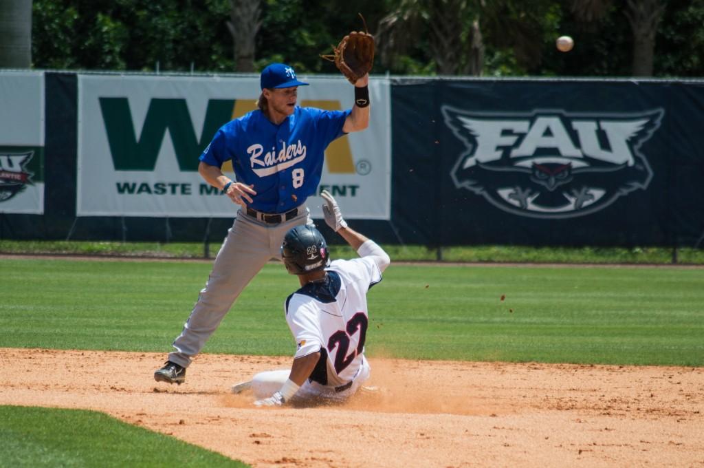 Third baseman Ricky Santiago slides in to second base after doubling for one of his two hits in the second game of the doubleheader. The Owls defeated Middle Tennessee 8-3. Photo by Cody Clarke.