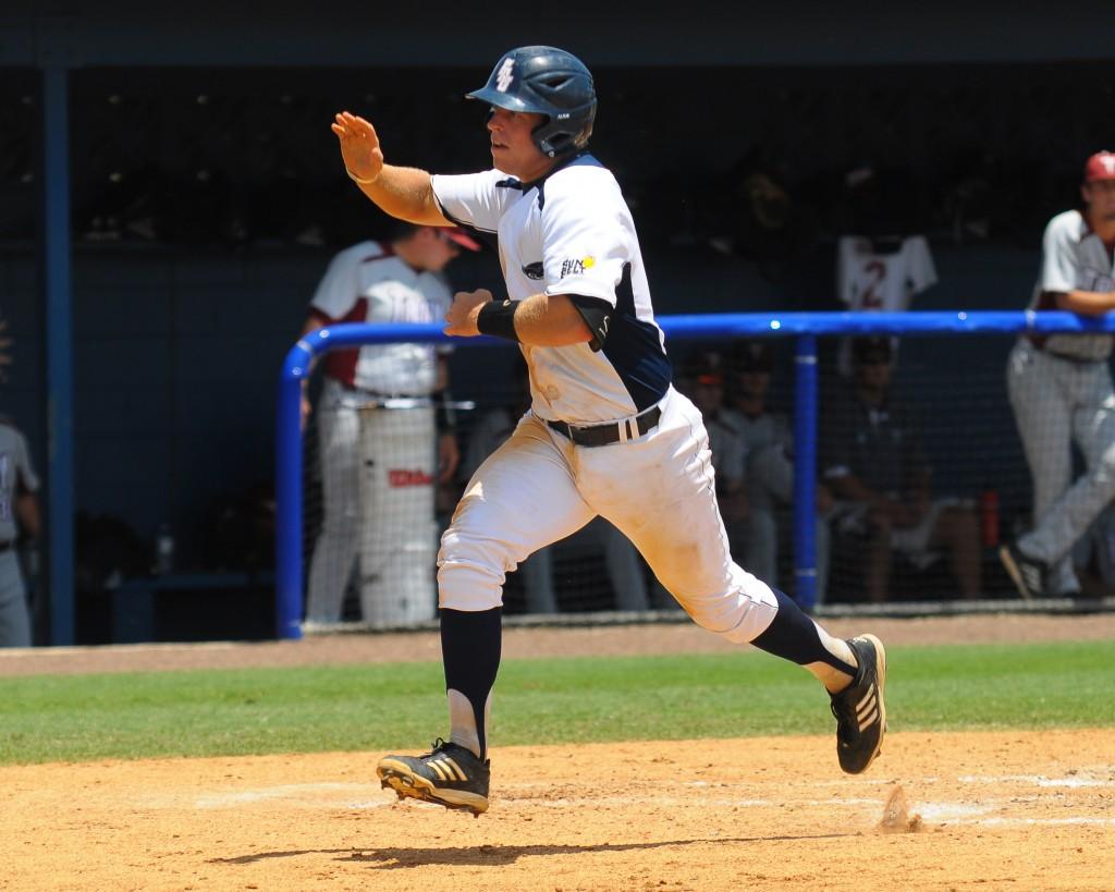 Catcher Levi Meyer crosses home plate to score the Owls' first run of the game off of Santiago's single to right field in the second inning. Photo by Michelle Friswell 