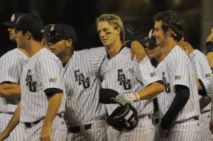 First baseman Mark Nelson (center) picked up two hits and two RBI's, one of which drove Sean Murrell in clinching the Owls' Friday night victory over Toledo. Photo by Michelle Friswell.