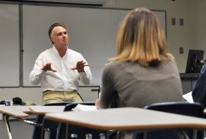 James Tracy introduces himself in his first class of the semester following the media coverage of his blog posts about the Newtown shooting.