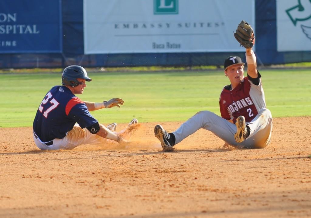 Number 27 Nathan Pittman slides into second base only to be called out by the umpire. The Owls defeated Troy 1-0 in the Saturday game. Photo by Michelle Friswell