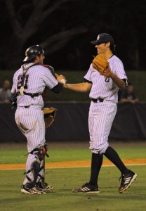 Catcher Mike Spano (left) and closer Hugh Adams (right) celebrate after the last play that secured the Owls' victory over FGCU. Photo by Michelle Friswell.