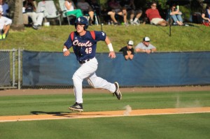 Second baseman Robert Buckley runs into home off of Levi Meyer's sacrifice fly in the bottom of the fifth inning. Buckley scored three runs and picked up two RBIs in Saturday's victory. Photo by Michelle Friswell.