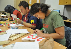 Members of the Students for Justice in Palestine work on flags for their demonstration, which will be on Feb. 7 on the free speech lawn from 10 a.m. to 2 p.m. Photo by Michelle Friswell.