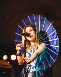 Sydney Sierota, lead vocalist of Echosmith, rocking the cocktail umbrella during her performance at the Burrow Bar & Grill. Photo by Sean Webster