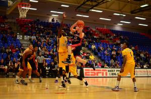 Jackson Trapp attempts to finish a layup at the rim through contact. Photo by Max Jackson 