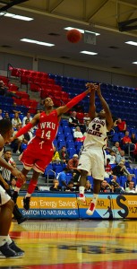 Owls guard Stefan Moody launching a jumper over a WKU defender. Moody had a career-high 26 points in FAU's 84-78 win. Photo by Max Jackson.