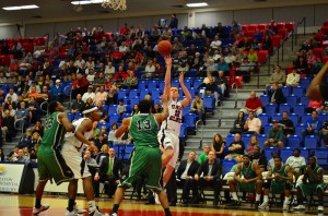 Owls guard Jackson Trapp attempts jump shot over North Texas defender. Photo by Max Jackson.