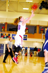 Kimberly Smith launches a three pointer from the right wing. Photo by Ralph Landau 