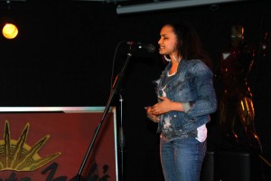 Natalie Cook did stand up poetry in Coyote Jack's at the event "End Discrimination Through the Arts." She touched on deep, heavy topics such as discrimination and molestation. Photo by Emilie Becker.