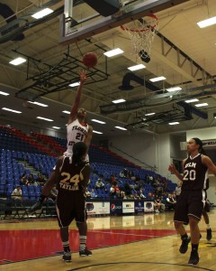 On her way to a career high 32 points, senior guard Breana Turner drives strong to the basket. Photo by Melissa Landolfa.