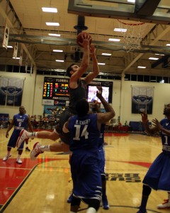 Pablo Bertone going up and splitting two Middle Tennessee defenders. FAU's junior guard had five points in the Owls' 73-56 loss. Photo by Melissa Landolfa.